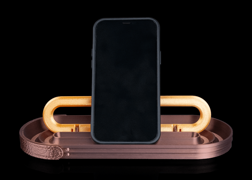 Smartphone on a decorative stand with a black background
