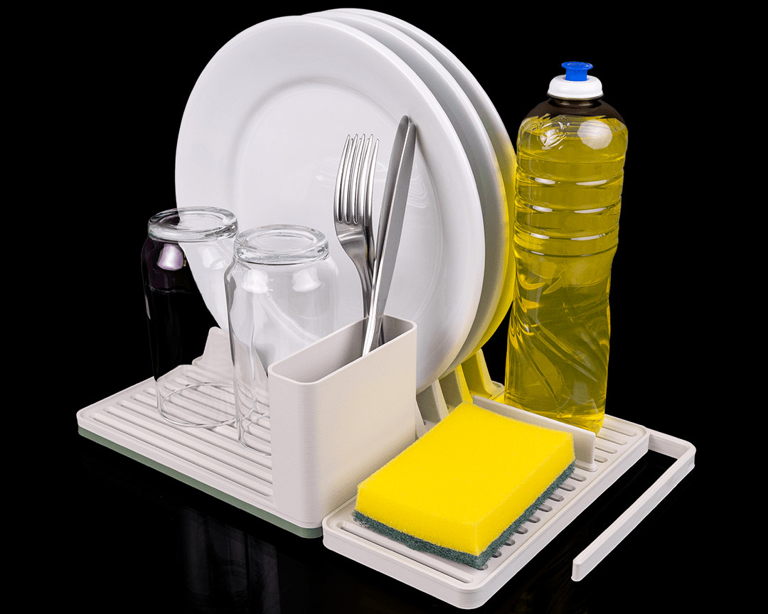 Dish drying rack with plates, glasses, utensils, and cleaning supplies on a black background